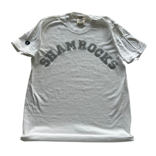 White crewneck t-shirt with silver shamrock patches